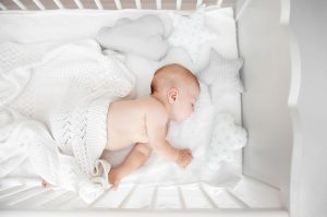Little,Baby,Sleeping,In,Crib,,,Top,View